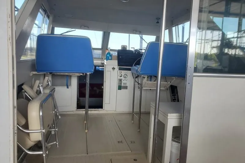 Slide: The Image of 1971 Chris-Craft 38 Commander interior with blue seating and control panel. - 9
