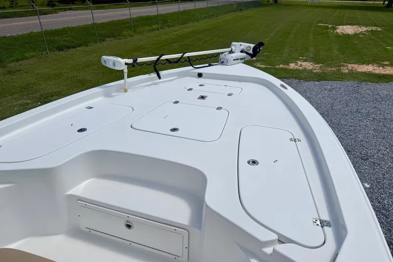 Slide: The Image of 2017 Sea Hunt BX25BR boat deck with storage compartments and trolling motor. - 6