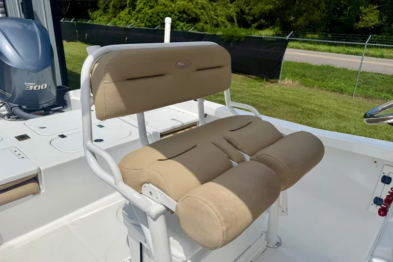 Slide: The Image of 2017 Sea Hunt BX25BR boat with beige seating and Yamaha 300 engine. - 9