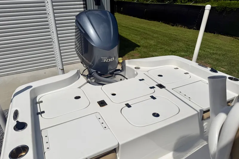 Slide: The Image of 2017 Sea Hunt BX25BR boat with Yamaha 300 engine, featuring spacious deck and storage compartments. - 14