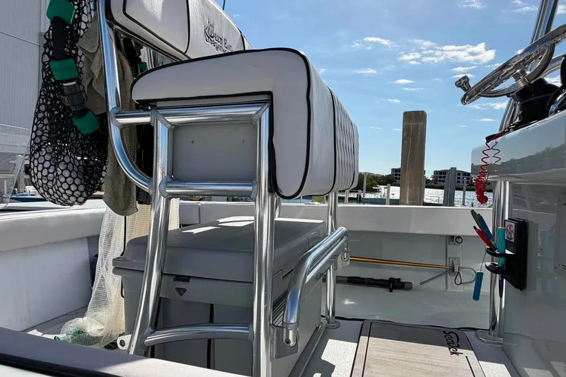 Slide: The Image of Interior of 2026 Custom West End Boat Works 25, featuring sleek seating and modern design. - 18