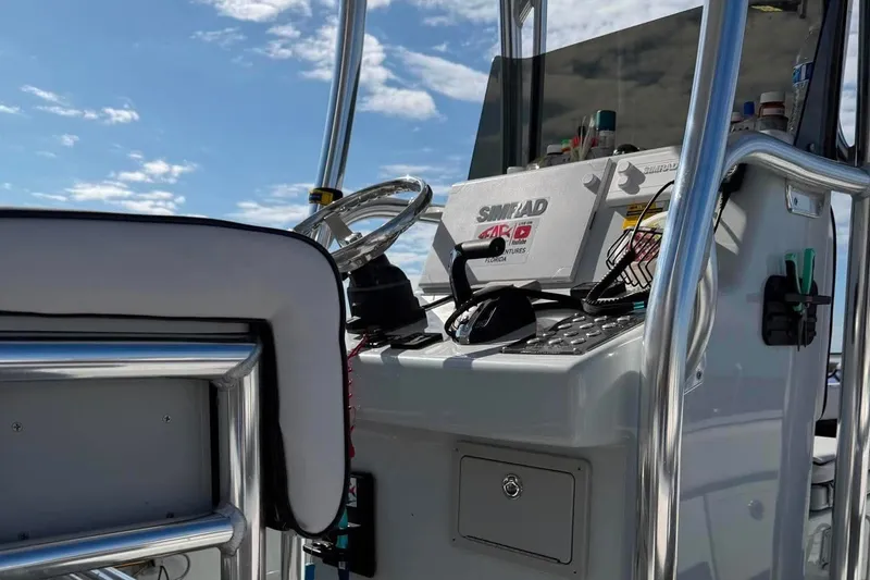 Slide: The Image of Control panel of 2026 Custom West End Boat Works 25 under a clear blue sky. - 19