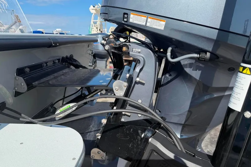Slide: The Image of Close-up of a 2026 Custom West End Boat Works 25 engine and mounting details. - 15