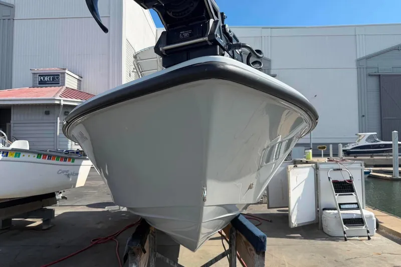 Slide: The Image of Front view of a 2026 Custom West End Boat Works 25 at a marina. - 20