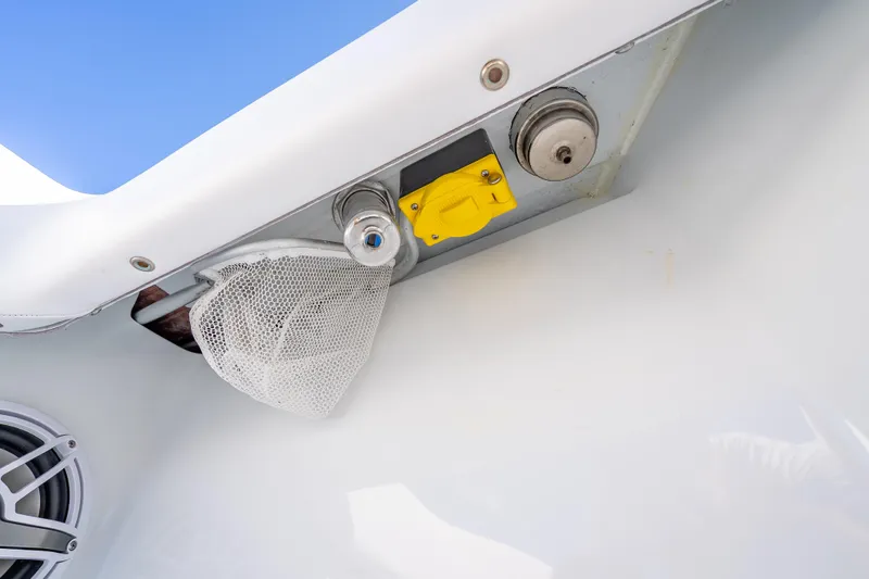Slide: The Image of 2026 Freeman 35 boat detail with speaker, netting, and metal fixtures against blue sky. - 14
