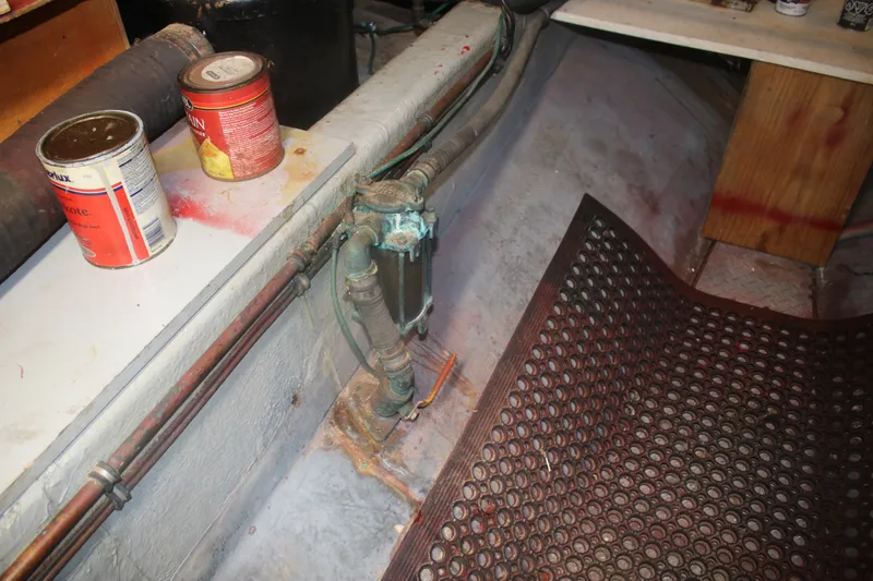 Slide: The Image of Engine room of 1981 Marine Trader 48 Trawler with paint cans and piping. - 47