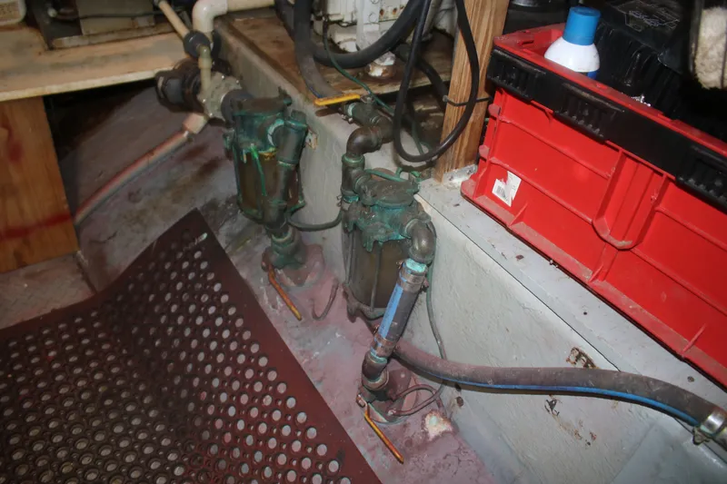 Slide: The Image of Engine room of 1981 Marine Trader 48 Trawler with visible piping and equipment. - 49