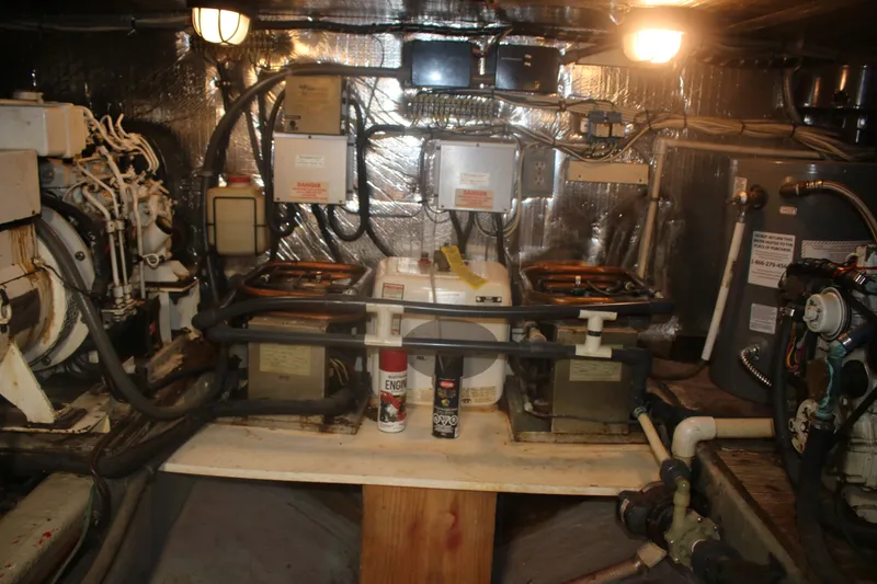 Slide: The Image of Engine room of 1981 Marine Trader 48 Trawler with mechanical components and wiring. - 18