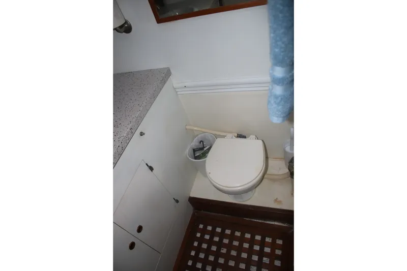 Slide: The Image of Marine Trader 48 Trawler 1981 bathroom with toilet and countertop. - 27