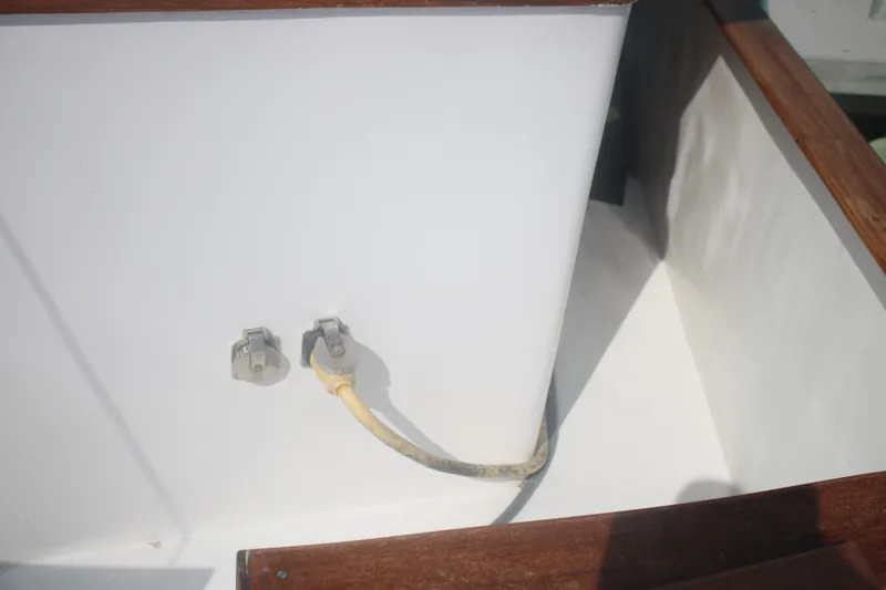Slide: The Image of 1981 Marine Trader 48 Trawler electrical connections on deck with wooden trim. - 22