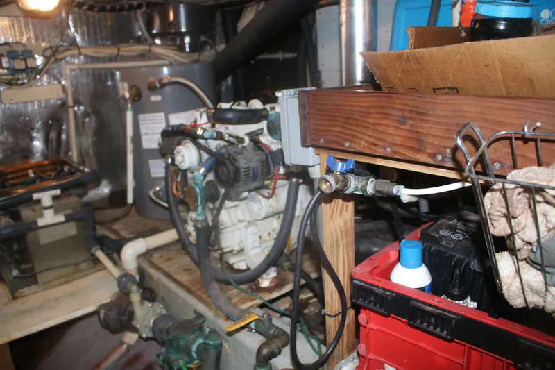 Slide: The Image of Engine room of a 1981 Marine Trader 48 Trawler with various mechanical components. - 45