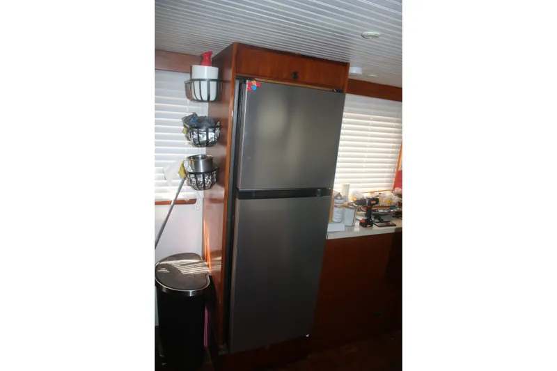 Slide: The Image of Stainless steel refrigerator in 1981 Marine Trader 48 Trawler kitchen interior. - 32