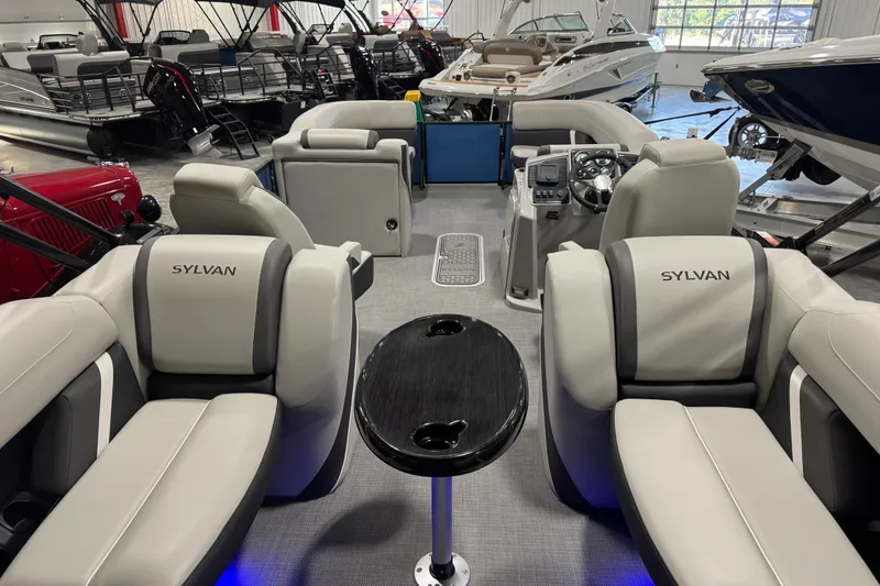 Slide: The Image of Interior of 2026 Sylvan X5 CLZ boat with luxurious seating and modern dashboard. - 14