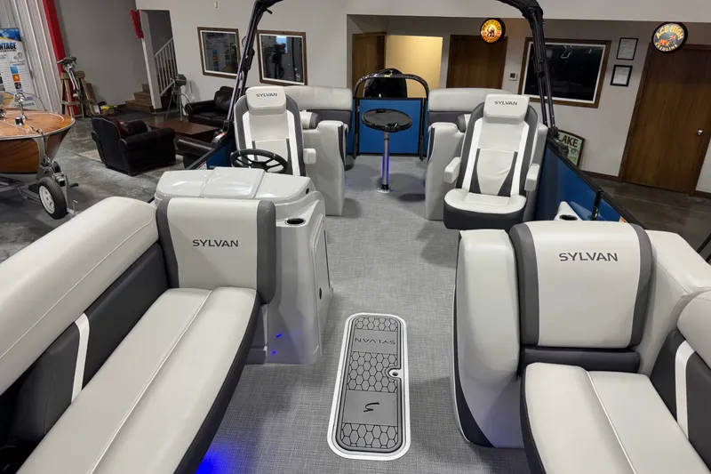 Slide: The Image of Interior of 2026 Sylvan X5 CLZ pontoon boat with modern seating and steering console. - 8