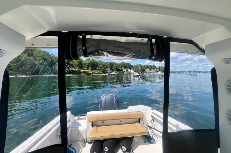Slide: The Image of 2005 Wellcraft 252 Coastal boat interior with scenic waterfront view and moored sailboats. - 28