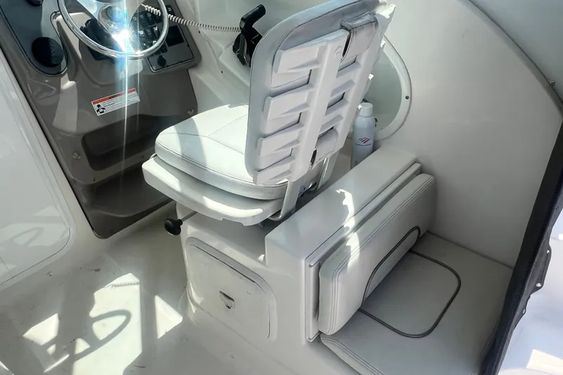 Slide: The Image of Interior of 2005 Wellcraft 252 Coastal boat showing helm seat and steering wheel. - 15
