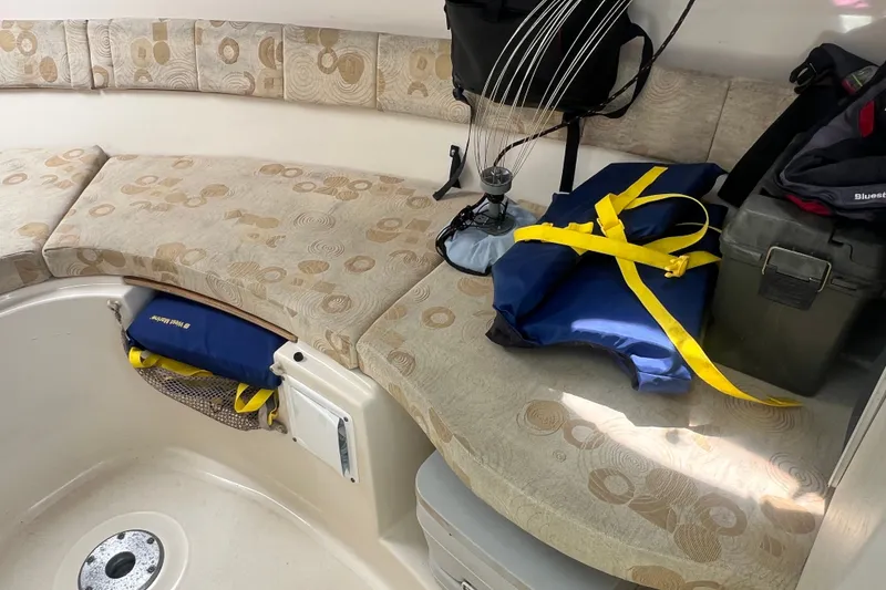 Slide: The Image of Interior of a 2005 Wellcraft 252 Coastal boat with seating and fishing gear. - 30