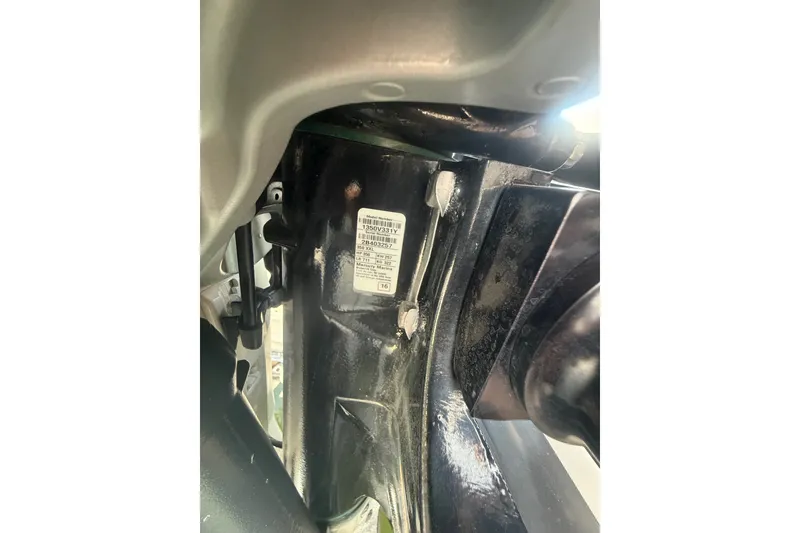 Slide: The Image of Close-up of a 2017 Sailfish 325 DC boat component with visible label and structural details. - 9