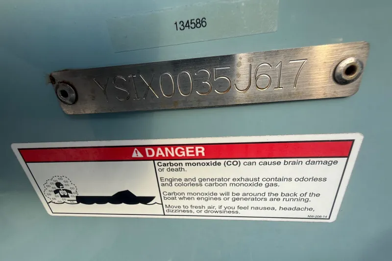 Slide: The Image of 2017 Sailfish 325 DC boat warning label and serial number plate. - 7