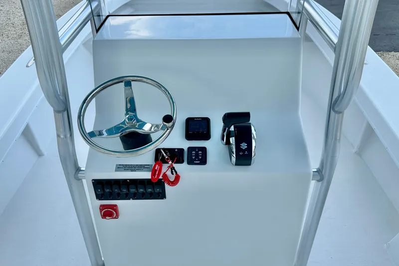 Slide: The Image of 2027 C-Hawk 25 Center Console helm with steering wheel and controls. - 19