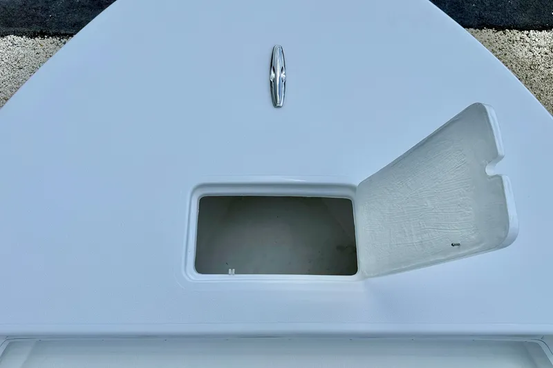 Slide: The Image of Open storage compartment on 2027 C-Hawk 25 Center Console boat deck. - 10