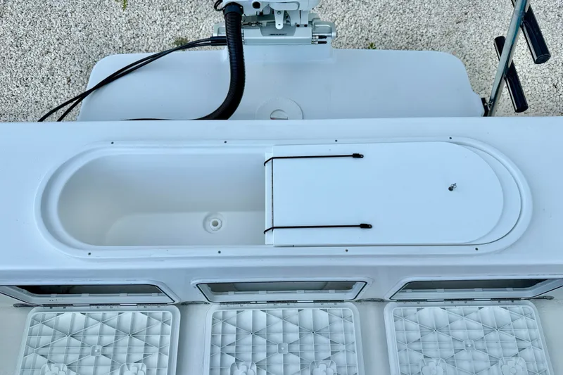 Slide: The Image of 2027 C-Hawk 25 Center Console boat deck with storage compartment and seating. - 30