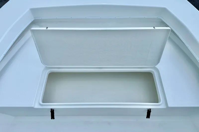 Slide: The Image of Open storage compartment on 2027 C-Hawk 25 Center Console boat. - 11