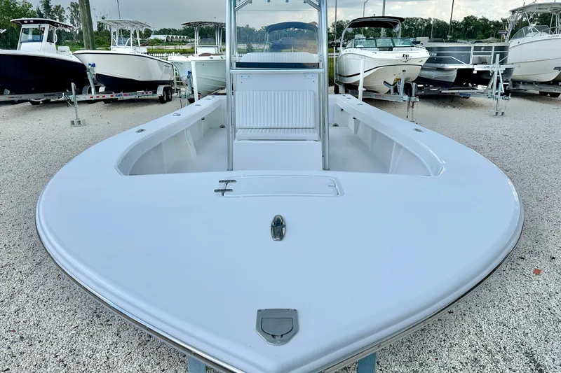 Slide: The Image of 2027 C-Hawk 25 Center Console boat displayed in a marina setting. - 8