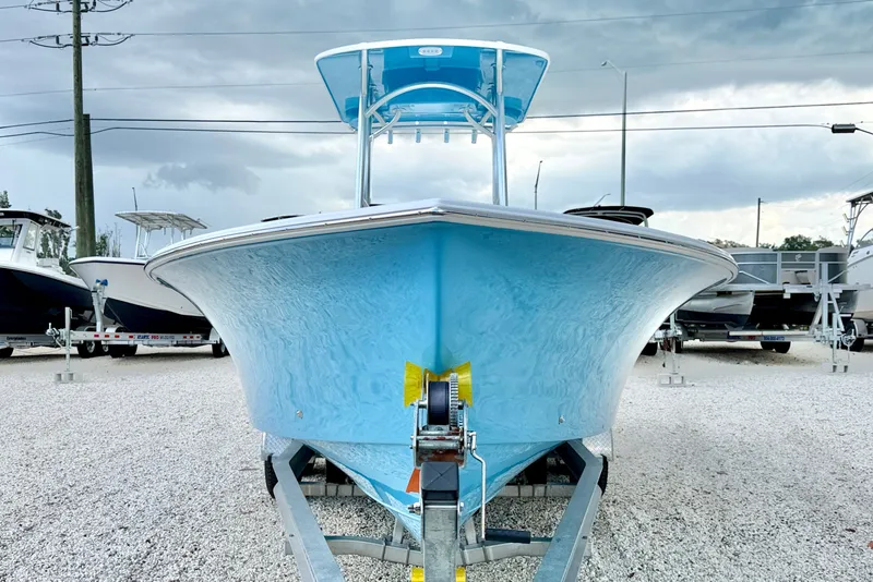 Slide: The Image of 2027 C-Hawk 25 Center Console boat on trailer, displayed outdoors. - 2