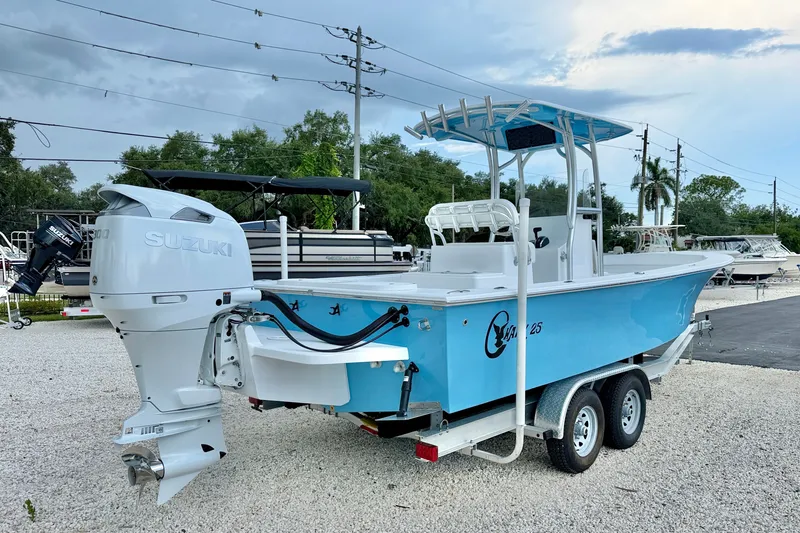 Slide: The Image of 2027 C-Hawk 25 Center Console boat with Suzuki outboard motor on trailer. - 6