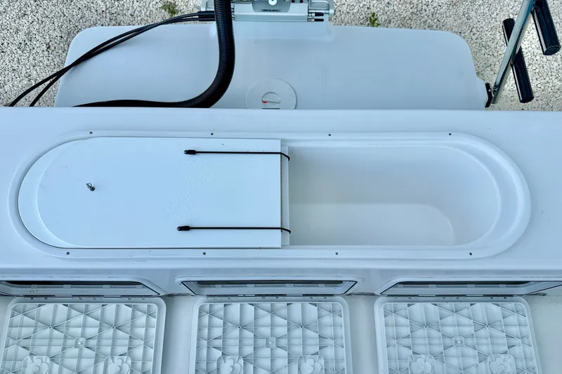 Slide: The Image of 2027 C-Hawk 25 Center Console boat interior with storage compartments. - 29