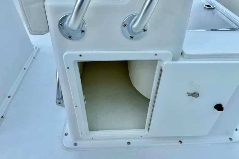 Slide: The Image of Open storage compartment on 2027 C-Hawk 25 Center Console boat. - 27