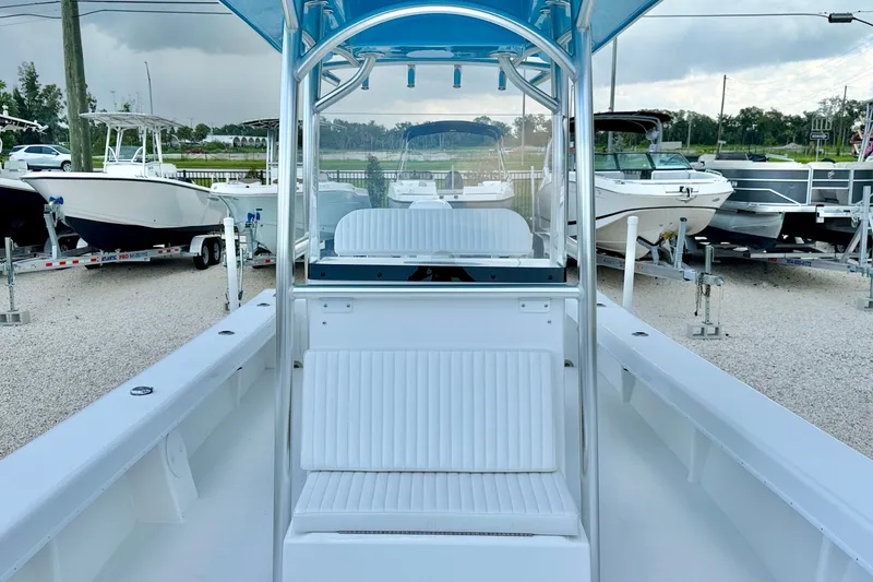 Slide: The Image of 2027 C-Hawk 25 Center Console boat displayed in a marina with other boats. - 12
