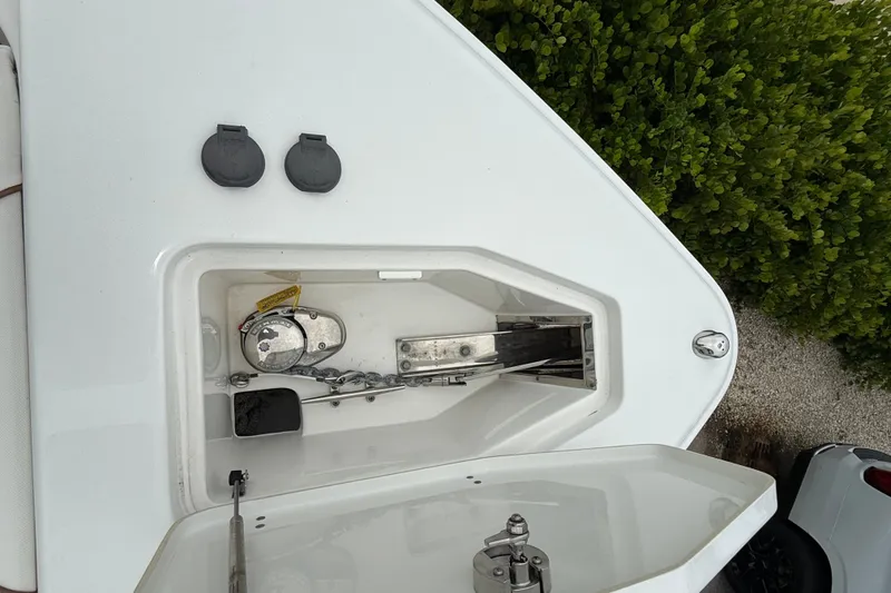Slide: The Image of 2018 Sea Hunt Gamefish 27 anchor compartment with open hatch and visible chain. - 15