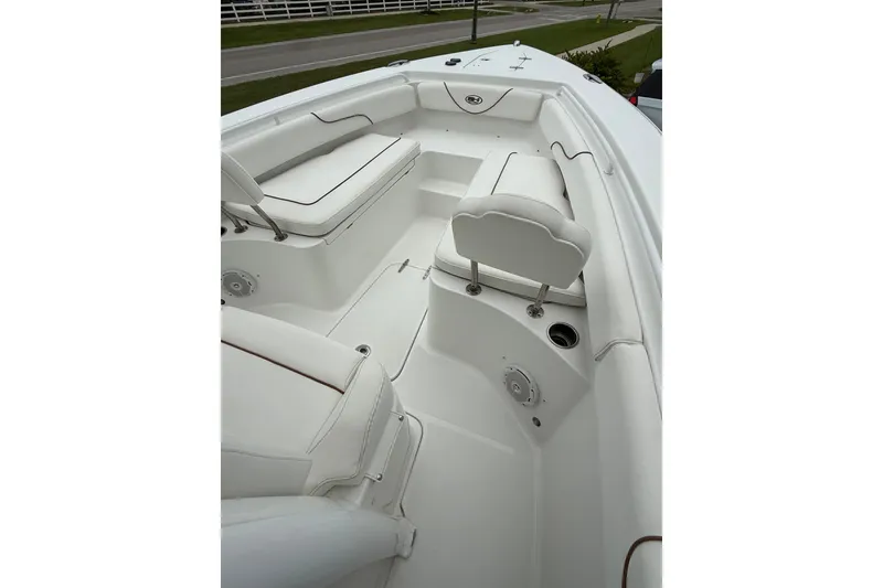 Slide: The Image of 2018 Sea Hunt Gamefish 27 boat interior with white seating and clean design. - 8