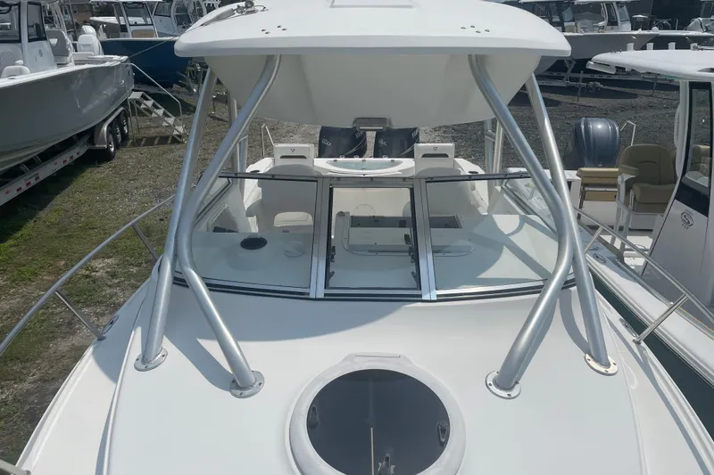 Slide: The Image of 2011 Sea Fox 256 Walk Around boat with sleek design and sturdy frame in a marina. - 15