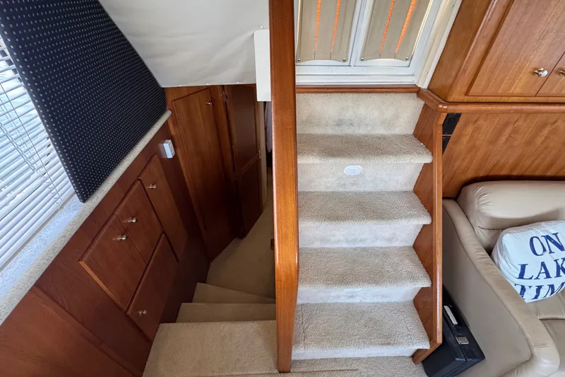 Slide: The Image of Interior of 2000 Carver 406 Aft Cabin Motor Yacht with carpeted stairs and wooden cabinetry. - 29