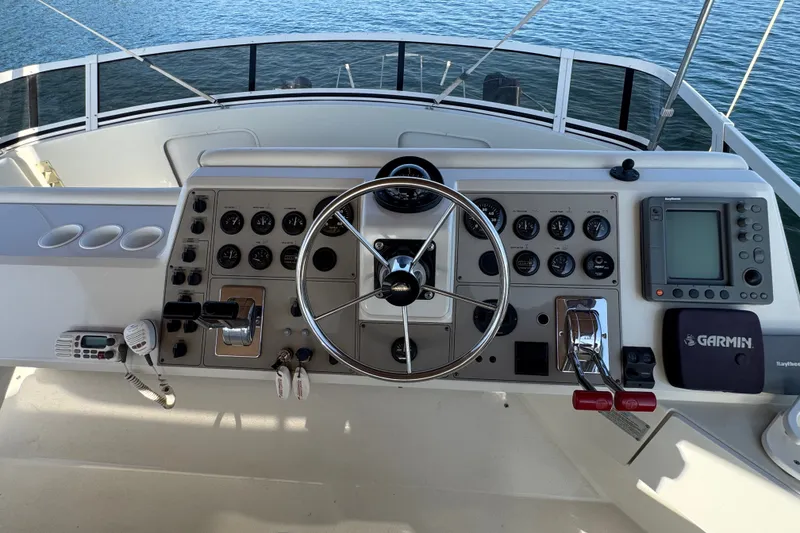 Slide: The Image of Helm of 2000 Carver 406 Aft Cabin Motor Yacht with steering wheel and navigation instruments. - 17