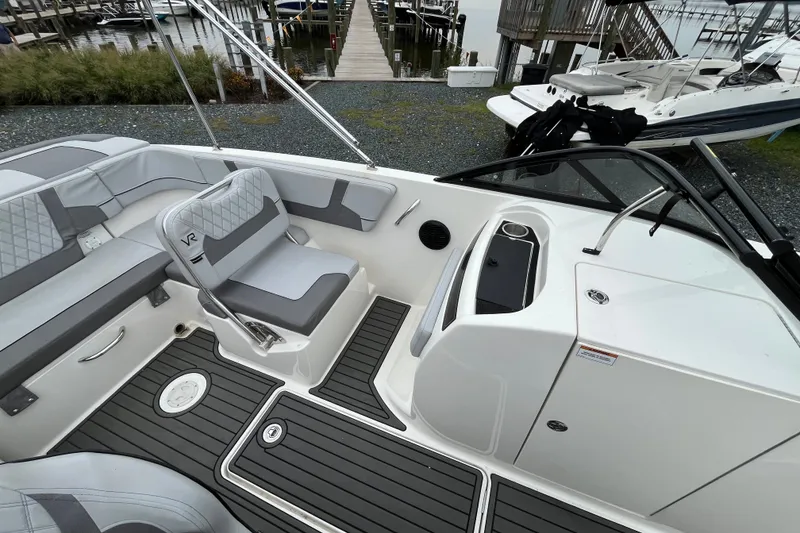 Slide: The Image of 2023 Bayliner VR6 Bowrider I/O interior with sleek seating and modern design. - 8