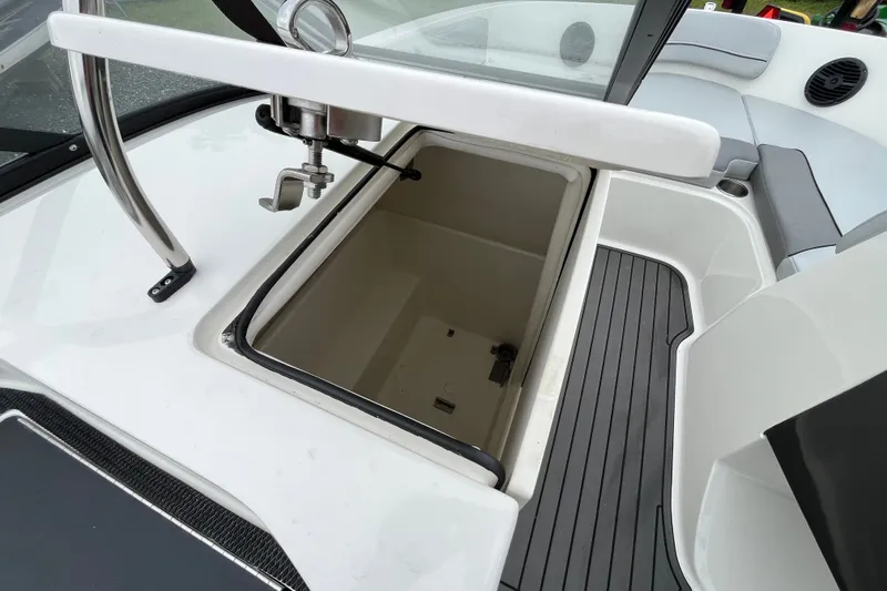 Slide: The Image of 2023 Bayliner VR6 Bowrider I/O storage compartment with sleek interior design. - 11