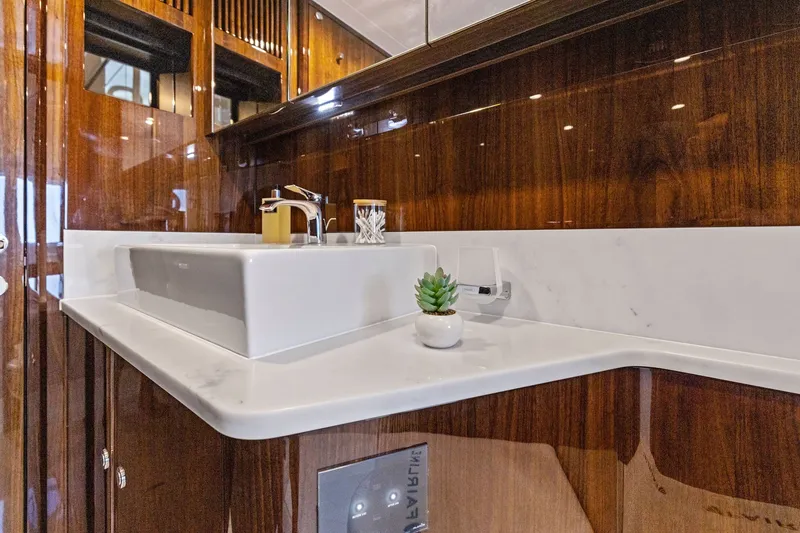 Slide: The Image of Luxurious bathroom interior of 2024 Fairline Phantom 65 yacht with elegant wood finish. - 28