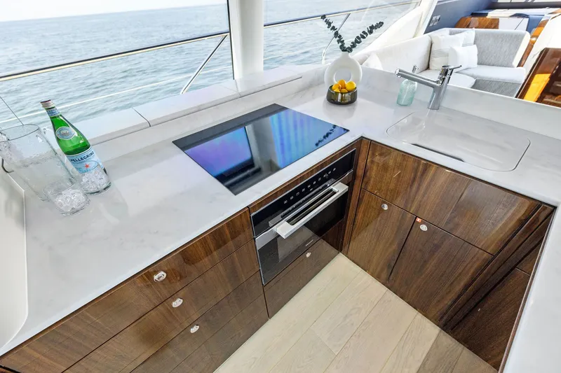 Slide: The Image of Luxurious kitchen on 2024 Fairline Phantom 65 yacht with modern appliances and ocean view. - 15