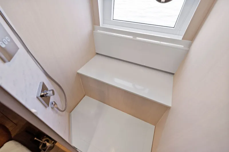 Slide: The Image of Modern shower area in 2024 Fairline Phantom 65 yacht with window view. - 26