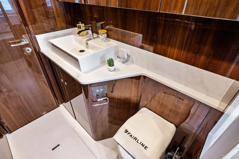 Slide: The Image of Luxurious bathroom interior of 2024 Fairline Phantom 65 yacht with elegant wood finish. - 29