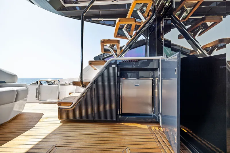 Slide: The Image of Luxurious 2024 Fairline Phantom 65 yacht deck with sleek design and modern amenities. - 10