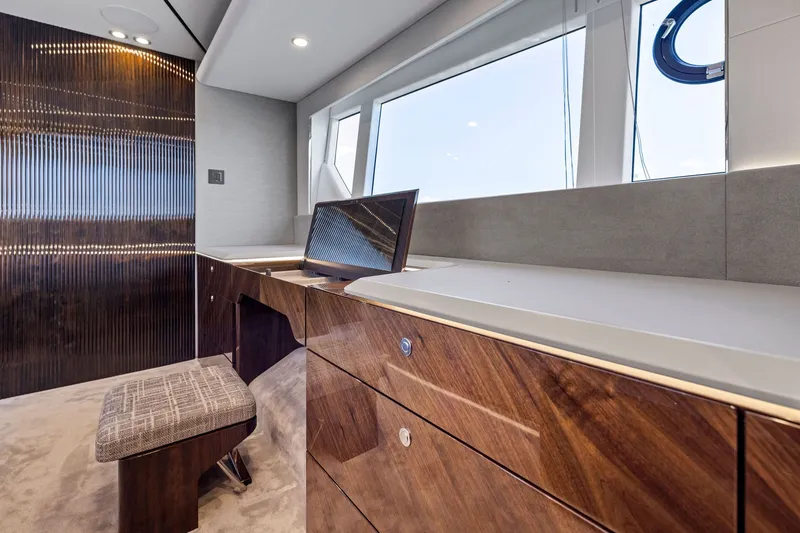 Slide: The Image of Luxurious interior of 2024 Fairline Phantom 65 yacht with elegant wood finish. - 27