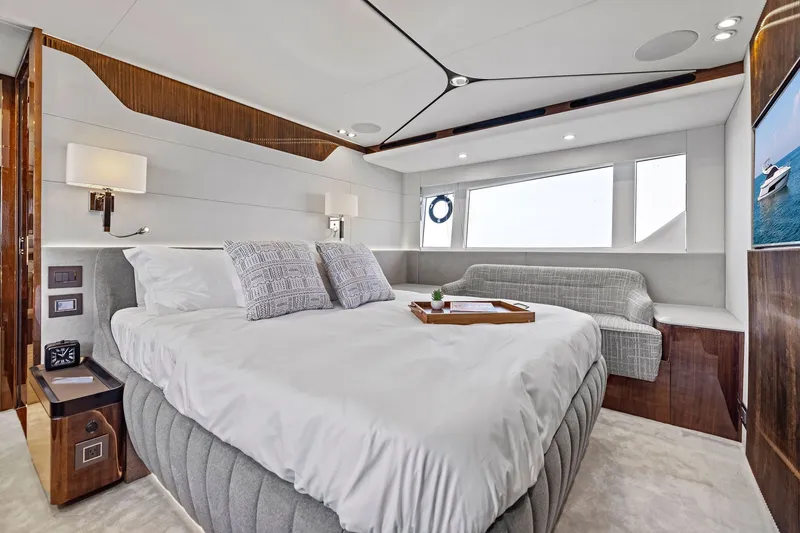 Slide: The Image of Luxurious bedroom interior of 2024 Fairline Phantom 65 yacht with modern design and elegant furnishings. - 37