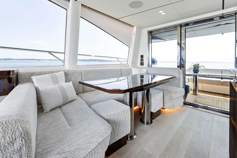 Slide: The Image of Luxurious interior of 2024 Fairline Phantom 65 yacht with elegant seating and ocean view. - 17