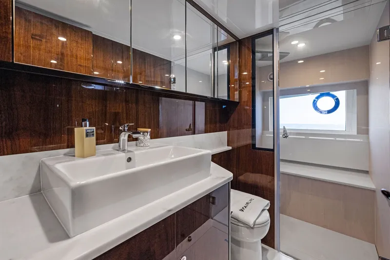 Slide: The Image of Luxurious bathroom in 2024 Fairline Phantom 65 yacht, featuring sleek design and modern fixtures. - 31