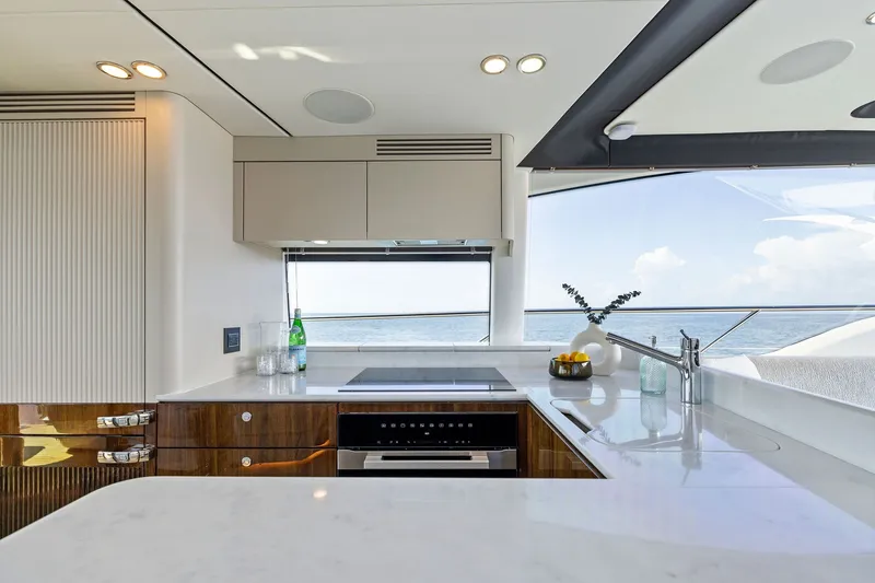 Slide: The Image of Luxurious kitchen interior of 2024 Fairline Phantom 65 yacht with ocean view. - 14